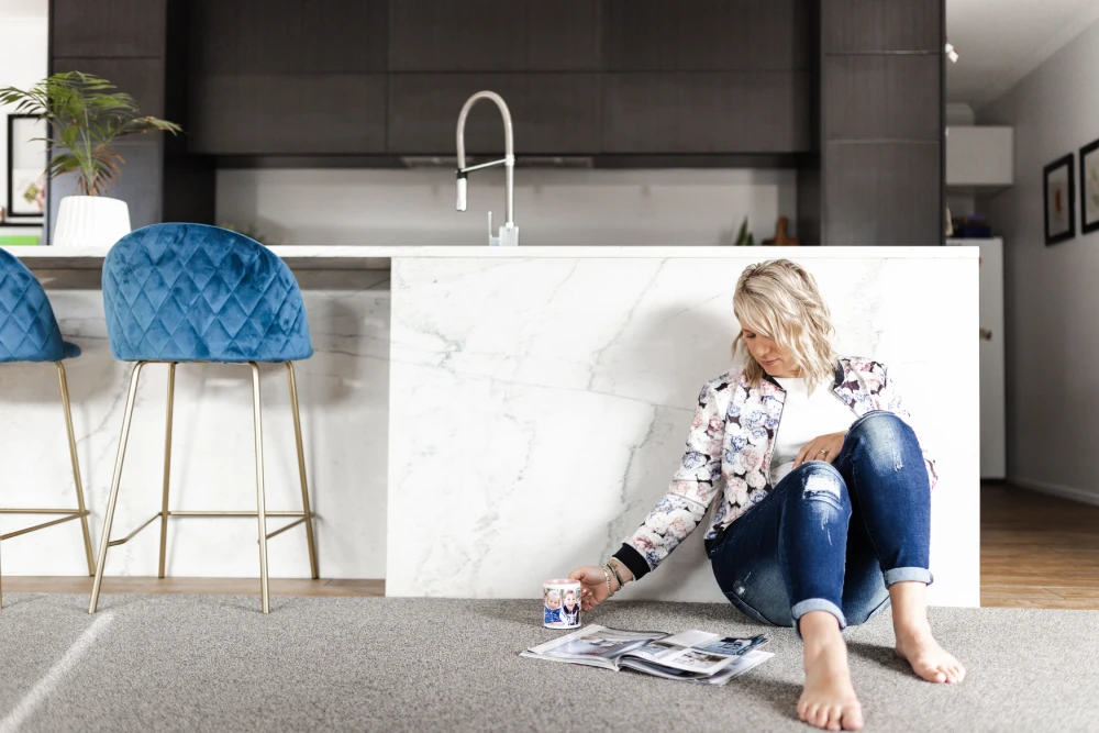 a woman sitting on the floor