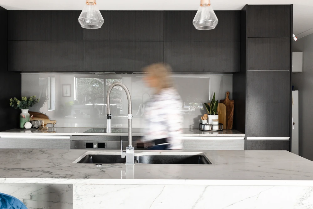 a blurry image of a person in a kitchen